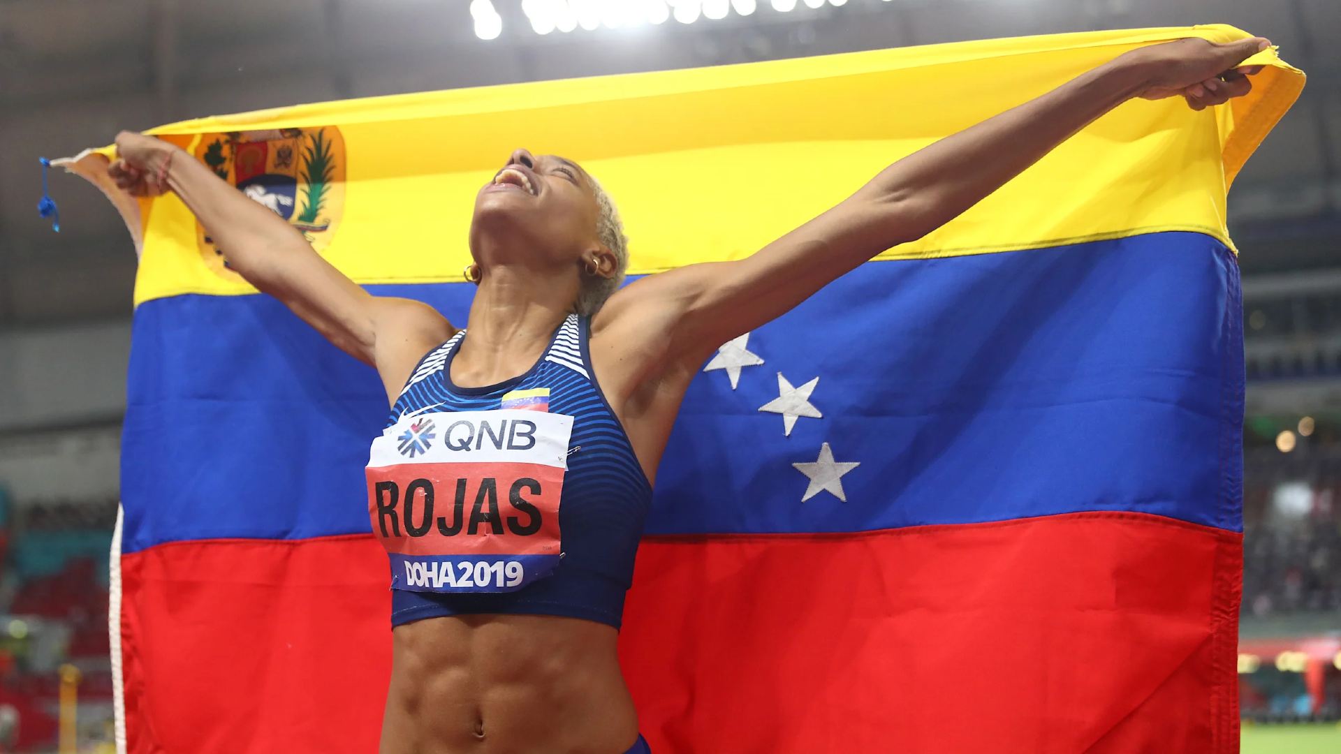 Yulimar Rojas holding the Venezuelan flag after winning the World Championships Doha 2019 (Image Credits - Instagram/ @yulimarrojas45)