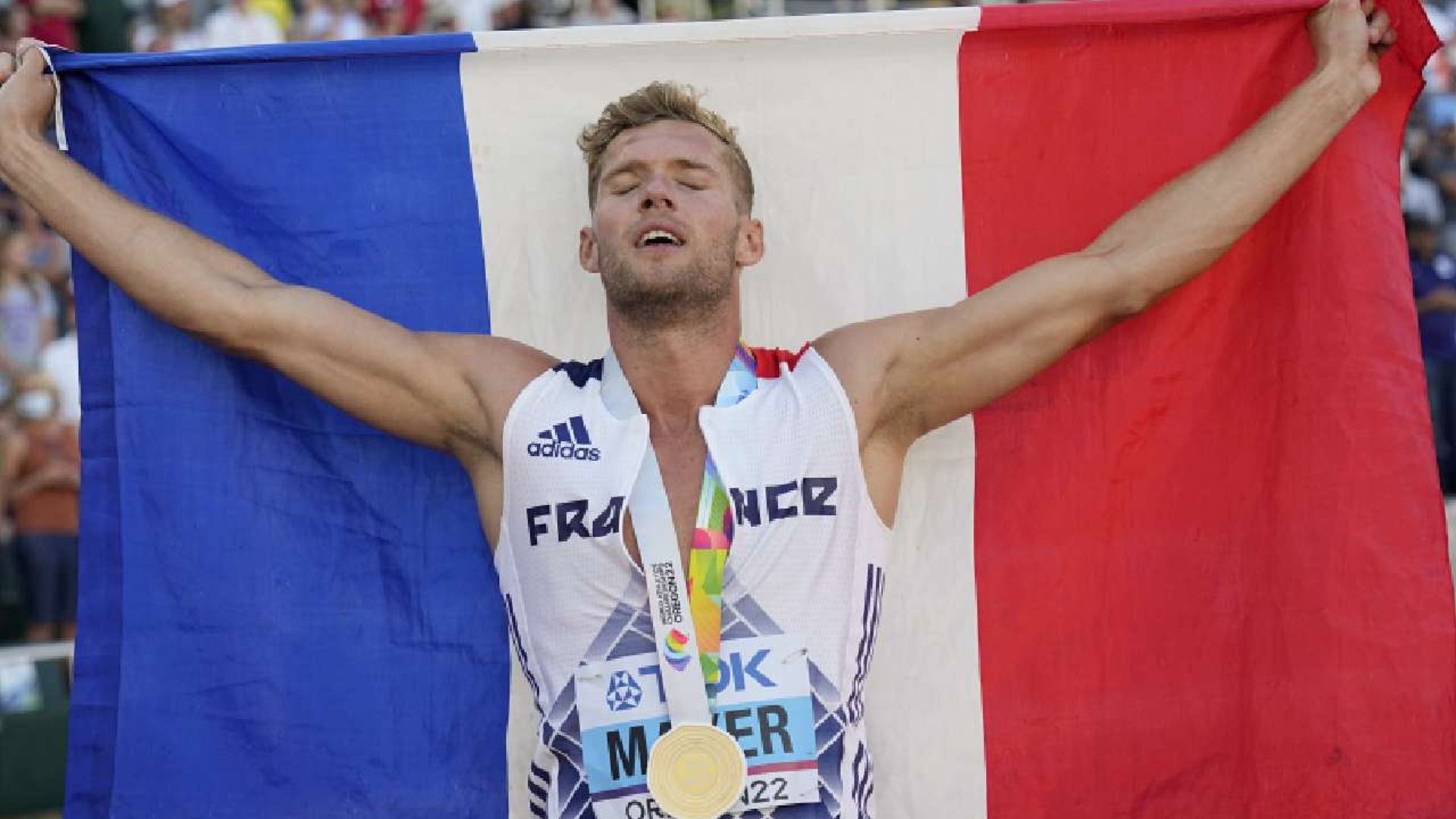 Kevin Mayer holding the French flag at Oregon 2022 (Mayer in a file photo)
