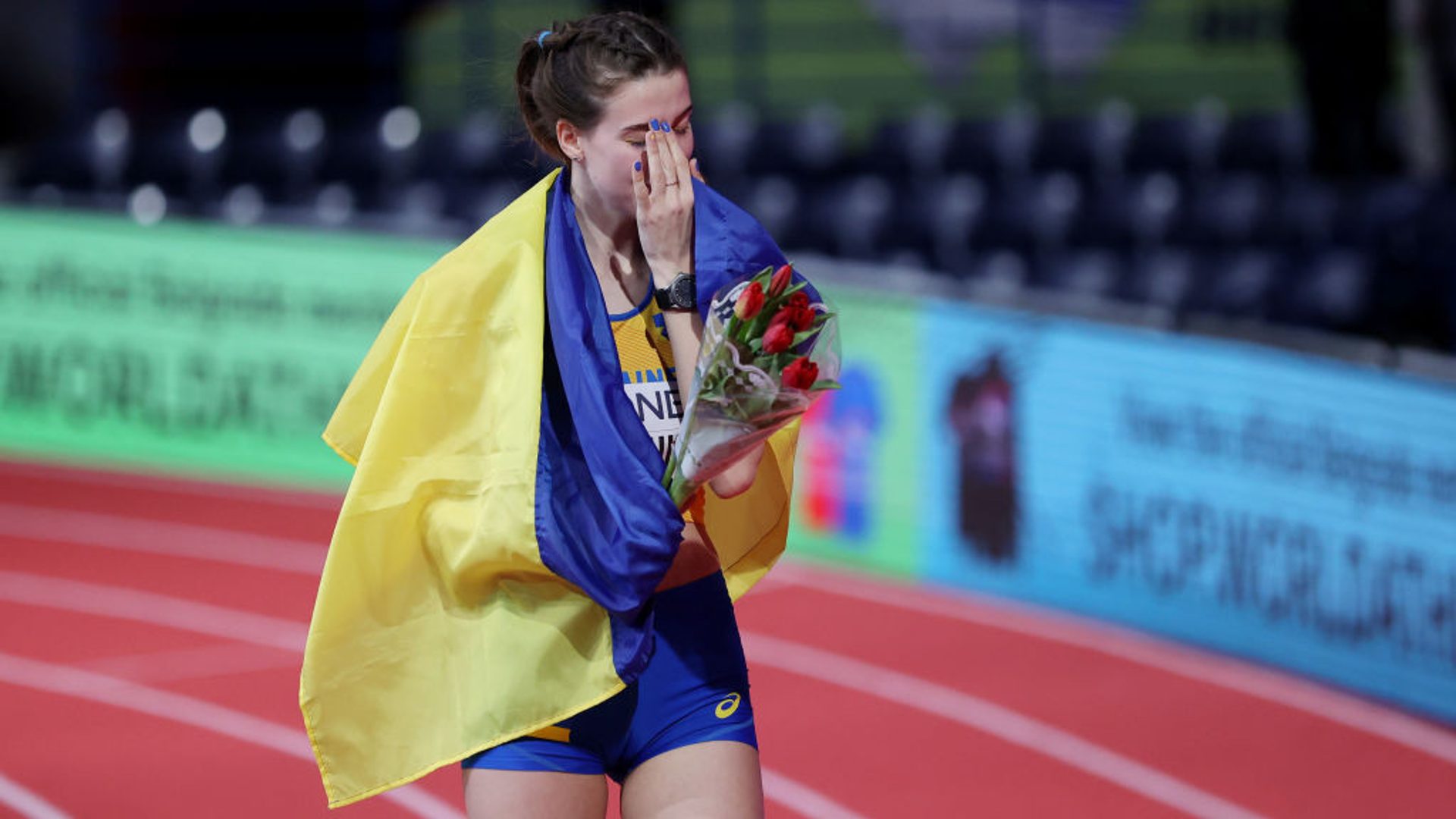 An emotional Yaroslava Mahuchikh after winning the Indoor World Championship 2022, just a few weeks after Russia's invasion of Ukraine