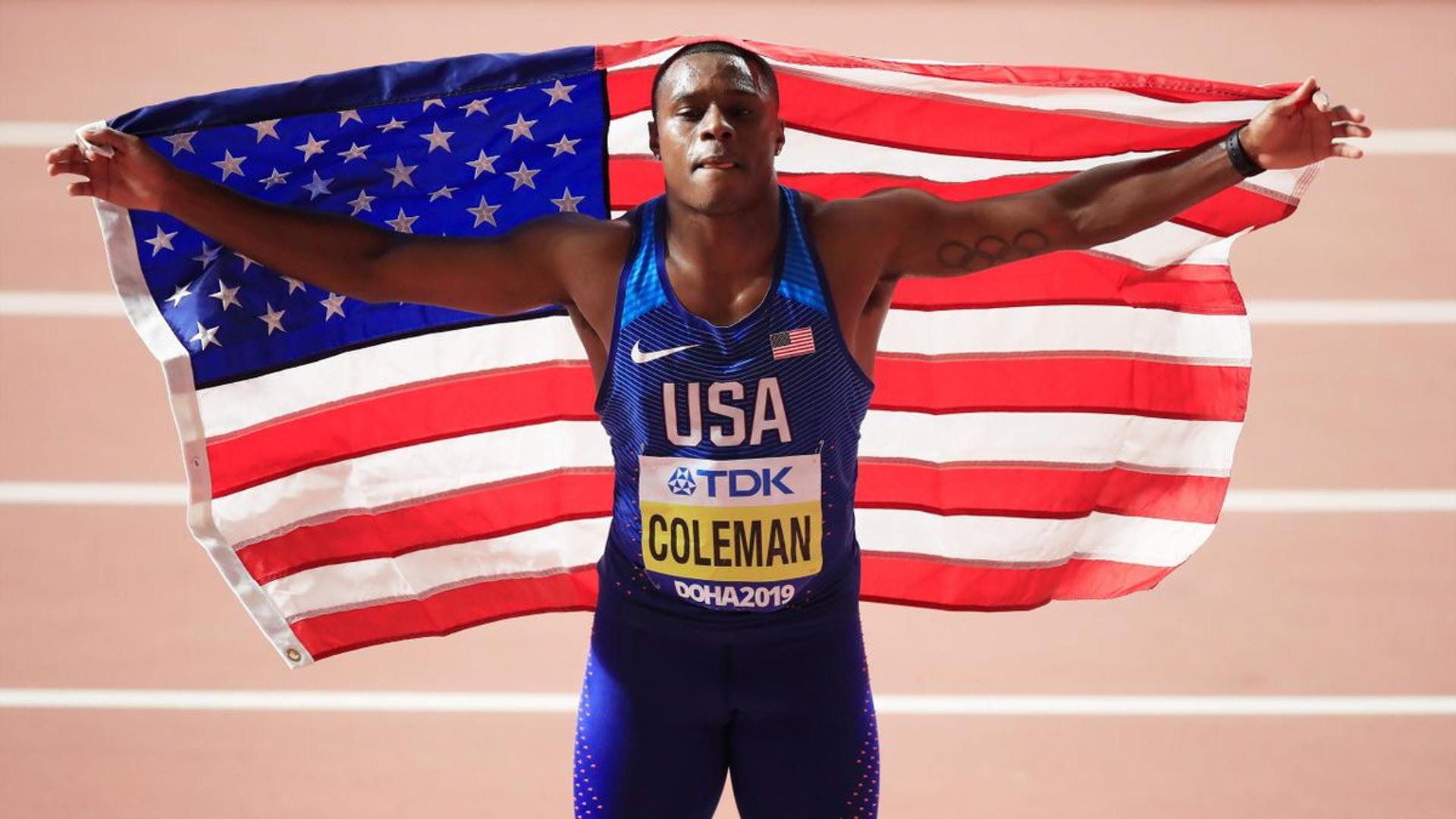 Christian Coleman holding the USA flag post his victory at the World Championships 2019 (Coleman in a file photo)