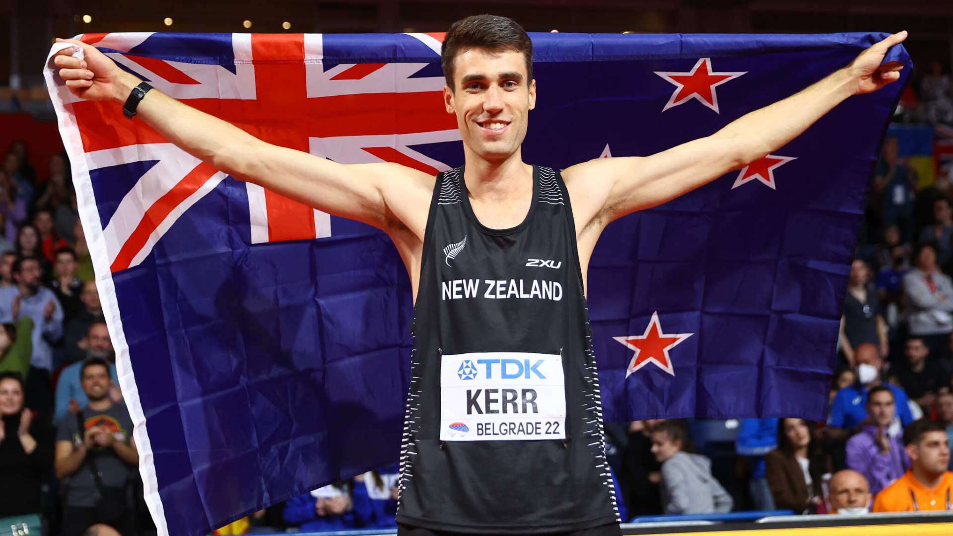 Hamish Kerr holding the New Zealand flag at the World Athletics Indoor Championships 2022 (Image Credits - Twitter)